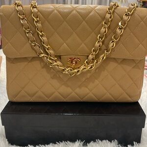 Vintage Chanel jumbo single flap in camel caviar leather with gold hardware.